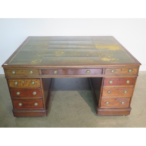 262 - A 19th Century mahogany partners desk with a leather inset top with nine drawers to each side on pli... 