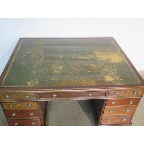 262 - A 19th Century mahogany partners desk with a leather inset top with nine drawers to each side on pli... 