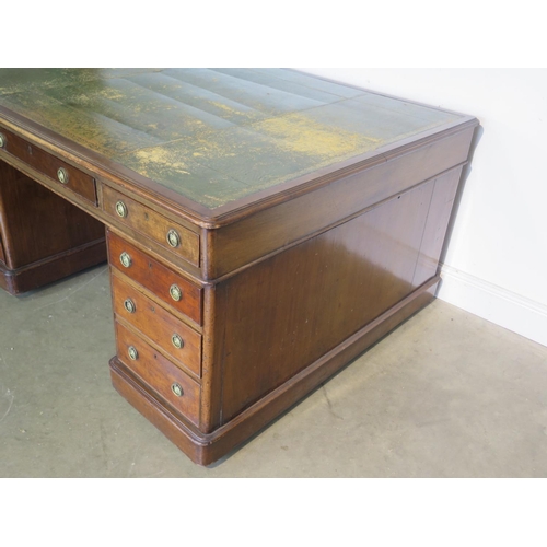 262 - A 19th Century mahogany partners desk with a leather inset top with nine drawers to each side on pli... 