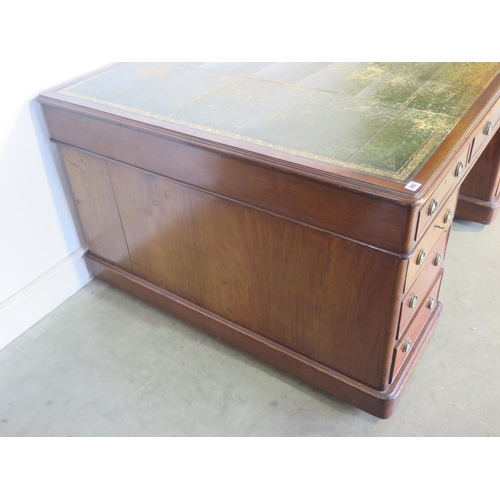 262 - A 19th Century mahogany partners desk with a leather inset top with nine drawers to each side on pli... 