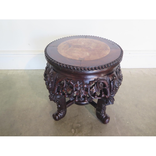 263 - An Oriental marble top carved mahogany jardiniere stand, with good colour, in good condition - H34cm... 