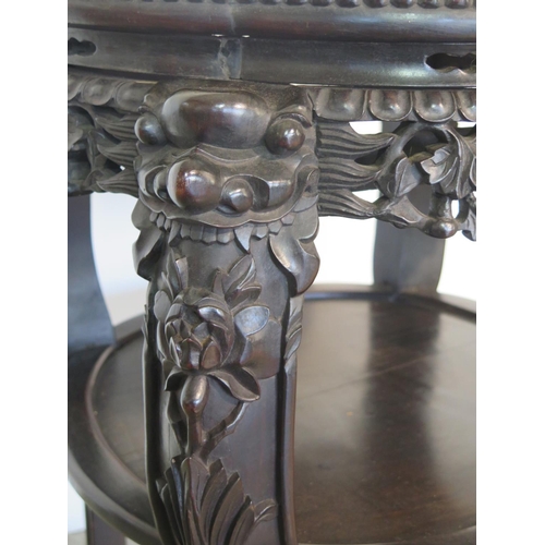 265 - A tall Oriental carved hardwood marble top jardiniere stand with under tier, with good colour and in... 