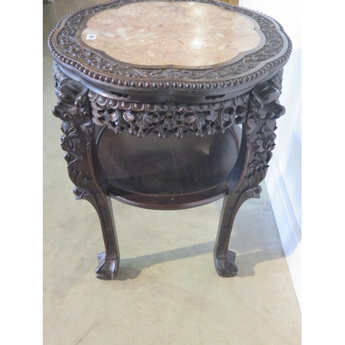 265 - A tall Oriental carved hardwood marble top jardiniere stand with under tier, with good colour and in... 