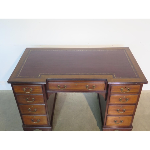 269 - A well restored Edwardian line inlaid mahogany kneehole desk, with an inverted leather inset top ove... 