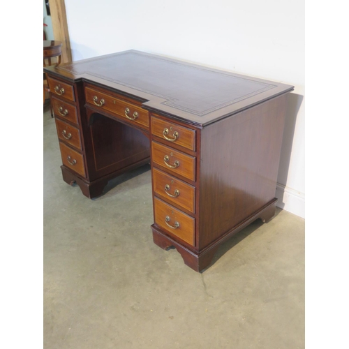 269 - A well restored Edwardian line inlaid mahogany kneehole desk, with an inverted leather inset top ove... 