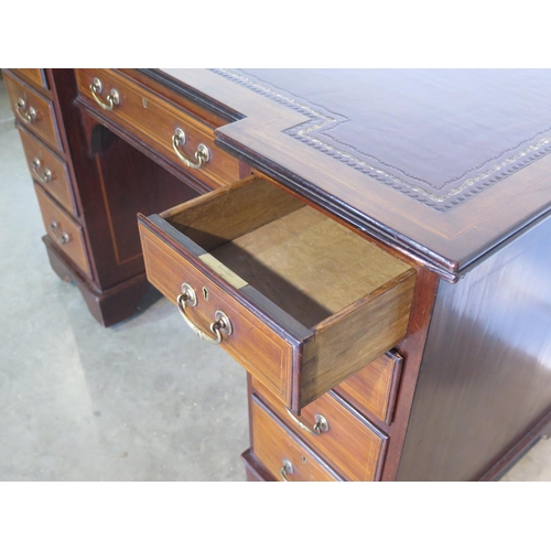 269 - A well restored Edwardian line inlaid mahogany kneehole desk, with an inverted leather inset top ove... 