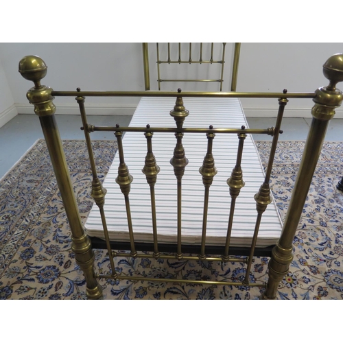 27 - A Victorian style brass single 3 foot bed with wooden fabric covered base, headboard 142cm tall