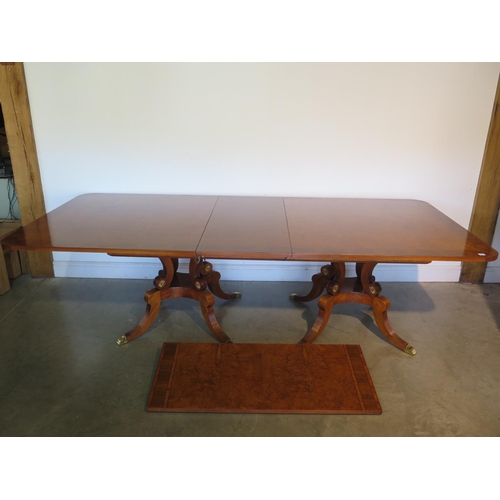 272 - A large walnut and satin wood twin pedestal dining table with two additional leaves, approx 320cm x ... 