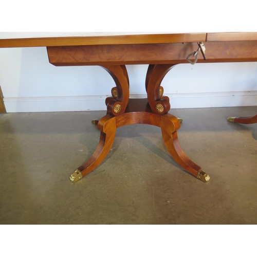 272 - A large walnut and satin wood twin pedestal dining table with two additional leaves, approx 320cm x ... 