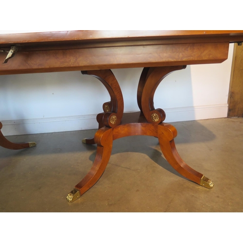 272 - A large walnut and satin wood twin pedestal dining table with two additional leaves, approx 320cm x ... 