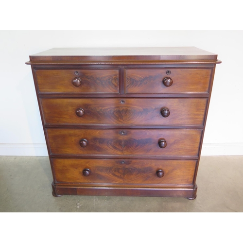 273 - A well restored Victorian mahogany chest with two short over three long drawers on flattened bun fee... 