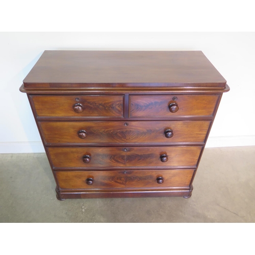 273 - A well restored Victorian mahogany chest with two short over three long drawers on flattened bun fee... 