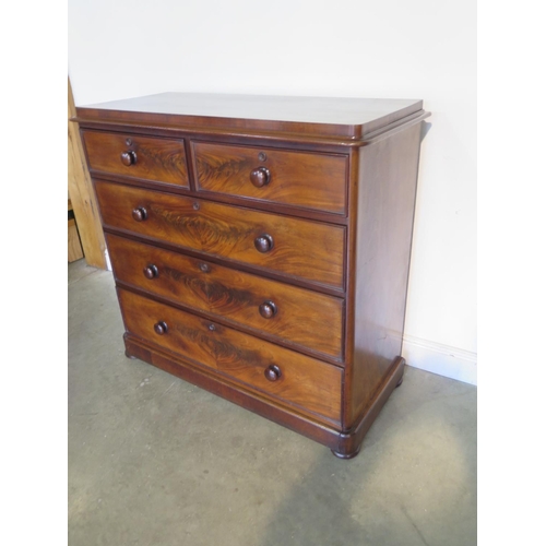 273 - A well restored Victorian mahogany chest with two short over three long drawers on flattened bun fee... 