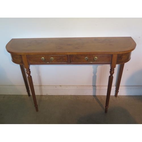 277 - A burr walnut D shaped hall/side table with two drawers on turned reeded legs, made by a local craft... 