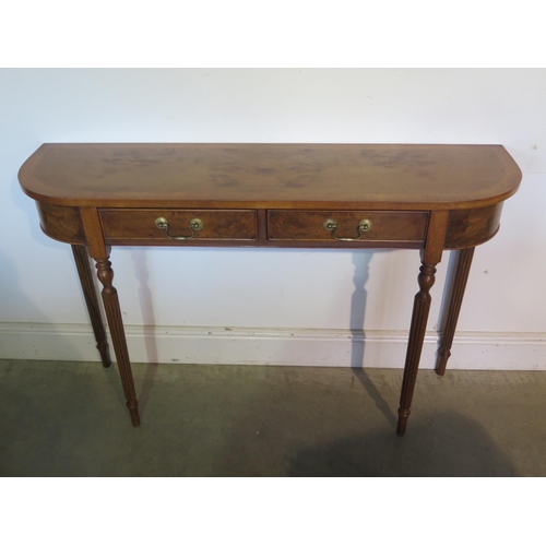 277 - A burr walnut D shaped hall/side table with two drawers on turned reeded legs, made by a local craft... 