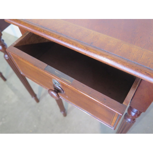 279 - A pair of mahogany lamp tables each with a single drawer on turned reeded legs, made by a local craf... 