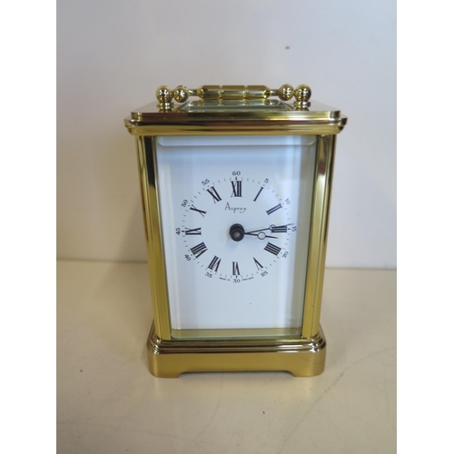 403 - A presentation brass carriage clock, the dial signed Aprey - 11cm tall, in clean running condition, ... 