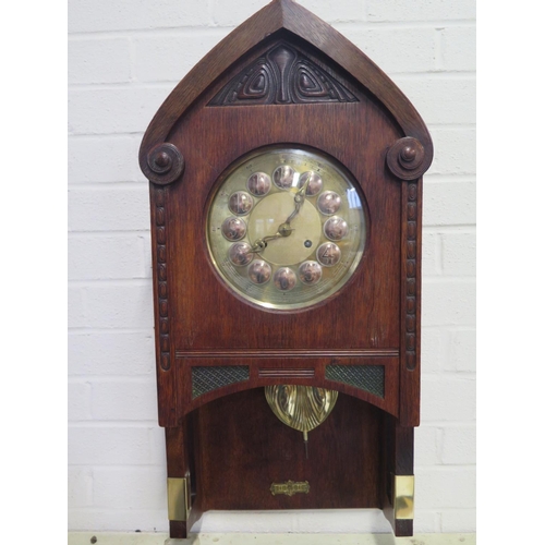 407 - An Art Nouveau Vienna secessionist oak wall clock by Gustav Becker with brass and copper dial striki... 