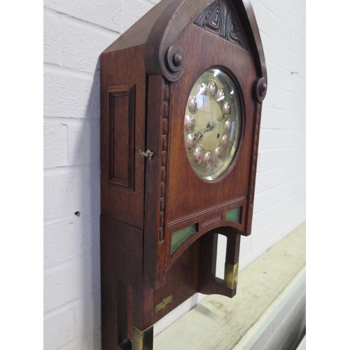 407 - An Art Nouveau Vienna secessionist oak wall clock by Gustav Becker with brass and copper dial striki... 