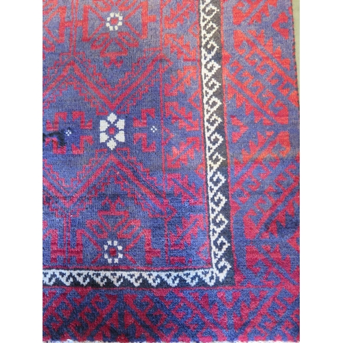 459 - A hand knotted woollen Baluchi rug 280cm x 124cm -in good condition