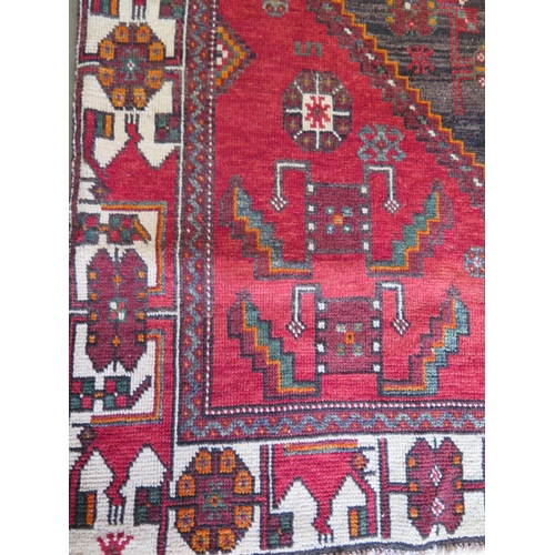 460 - A hand knotted woollen Baluchi rug - 300cm x 143cm - in good condition