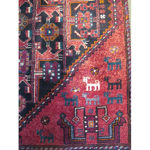 461 - A hand knotted woollen Baluchi rug 274cm x 122cm - in good condition