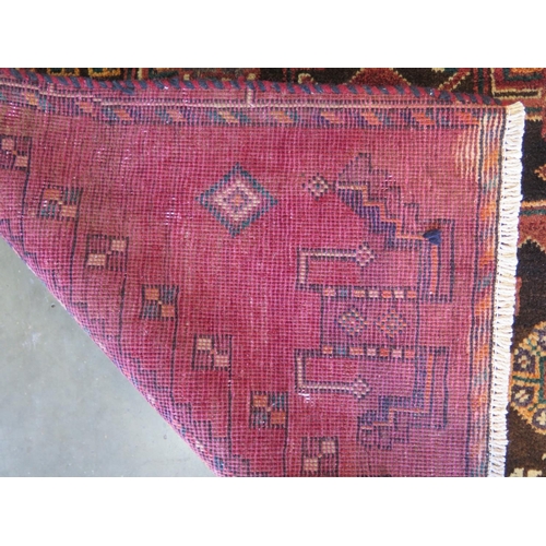 463 - A hand knotted woollen Baluchi rug 246cm x 106cm - in good condition