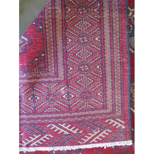 465 - A hand knotted woollen Baluchi rug 287cm x 200cm - good condition but some wear to middle