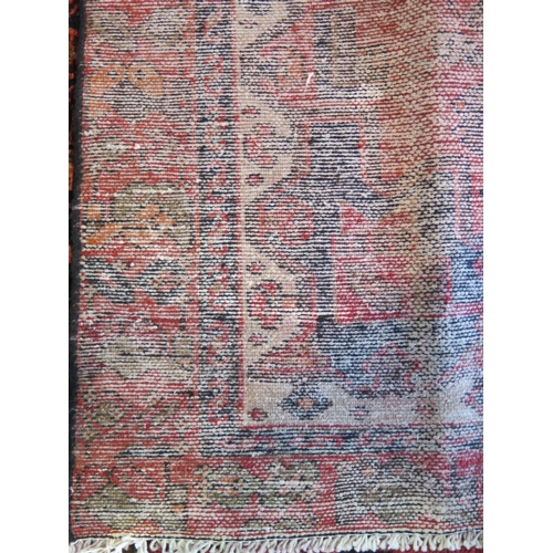 469 - A Hamadan red ground hand knotted woollen rug approx 206cm x 126cm - overall in good condition but w... 