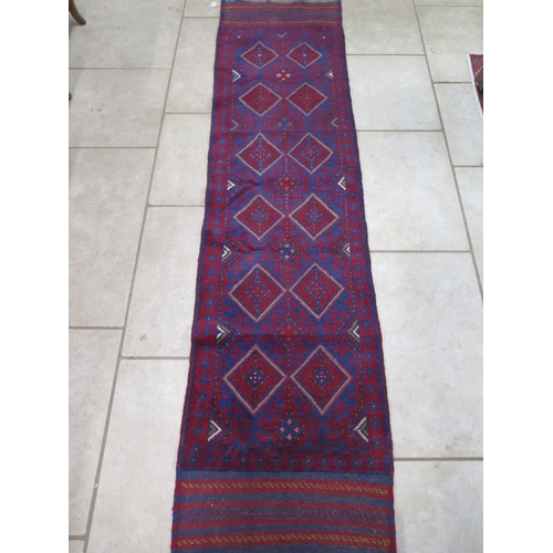 473 - A hand knotted woollen Meshwani runner - 251cm x 63cm