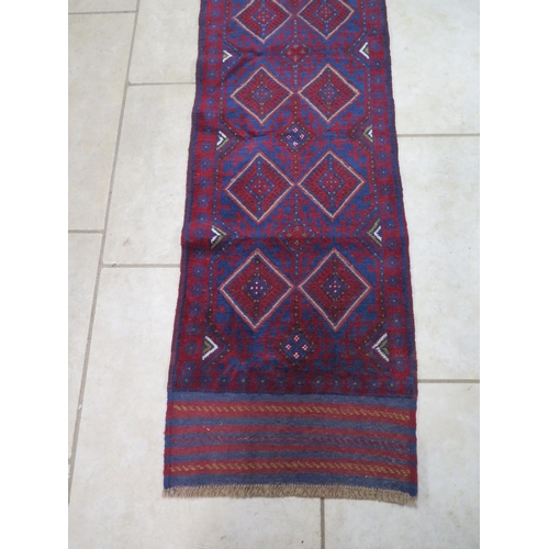 473 - A hand knotted woollen Meshwani runner - 251cm x 63cm