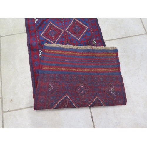 473 - A hand knotted woollen Meshwani runner - 251cm x 63cm