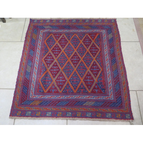 476 - A hand knotted woollen Gazak rug - 125cm x 120cm