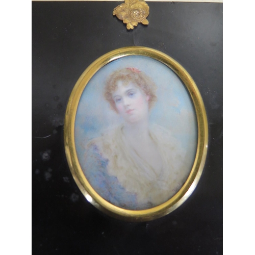 507 - A portrait miniature painting of a lady, signed Alwyn Williams, mounted in an ebonised frame, approx... 