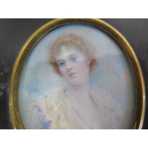 507 - A portrait miniature painting of a lady, signed Alwyn Williams, mounted in an ebonised frame, approx... 