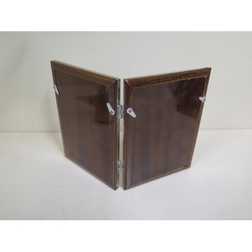 560 - A silver double folding photoframe marked 800 - with mahogany backs, 15cm x 10cm closed, minor denti... 