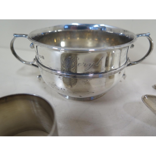 578 - A silver presentation twin handled bowl and a silver serviette ring, and five sterling spoons, total... 