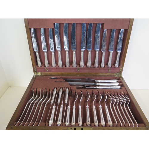 588 - A canteen of plated flatware, with engraved L to each handle, in good condition but with some wear