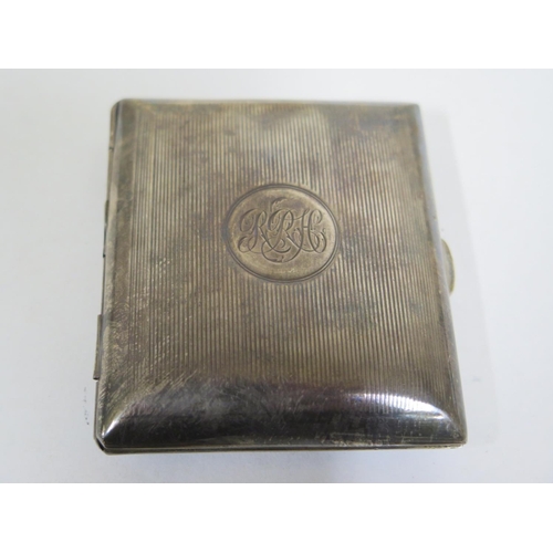 590 - A silver cigarette case, Birmingham 1906 - together with a silver Vesta case, Birmingham 1911 - and ... 