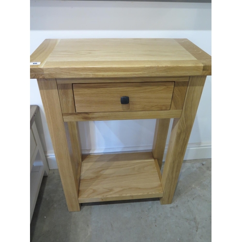 66 - An oak telephone table  - W65cm x D35cm x H85cm