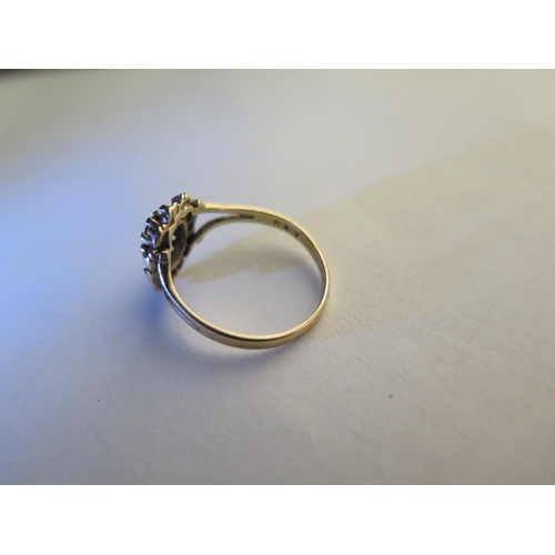 660 - A 9ct hallmarked yellow gold garnet ring, size L, approx 1.8 grams, some usage marks, consistent wit... 