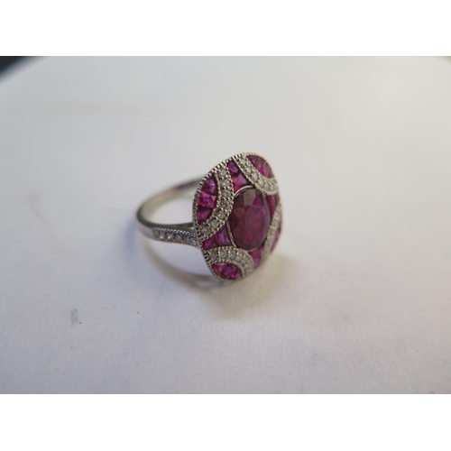 664 - An impressive 900 platinum ruby and diamond ring, with approx 0.30ct diamonds, and approx 4ct of Rub... 