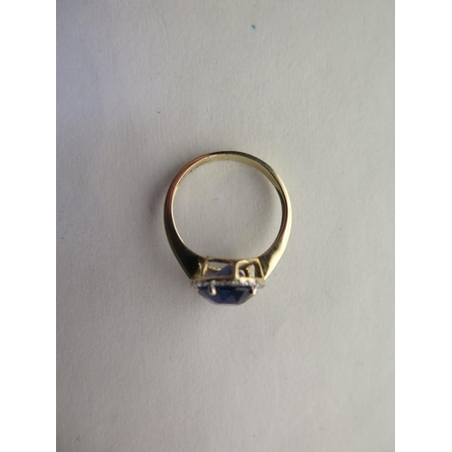 669 - A 14ct yellow gold sapphire and diamond ring, size N/O - approx 3.3 grams, sapphire approx 10mm x 8m... 