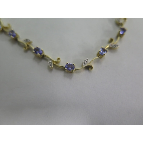 674 - A pretty 14ct tanzanite and diamond necklace, 42cm long, approx 16 grams, in good condition