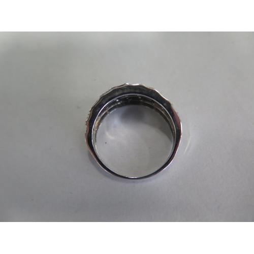 678 - A 9ct white gold black and white diamond set ring, size R, approx 4.3 grams, in good condition