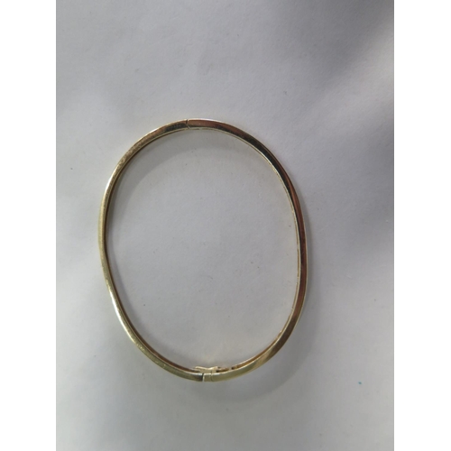 679 - A 14ct diamond set bangle, approx 7.5 gs  ,5cm x 6.5cm - minor usage marks, overall good condition