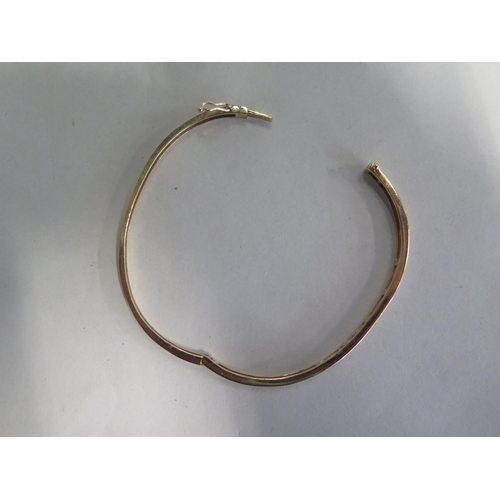 679 - A 14ct diamond set bangle, approx 7.5 gs  ,5cm x 6.5cm - minor usage marks, overall good condition