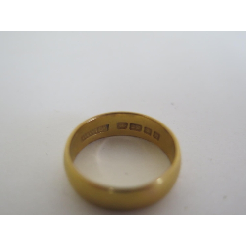 696 - A 22ct gold ring, approx 6.8 grams, ring size Q, generally in good condition but with some surface w... 