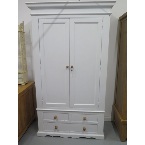 81 - A Shabby Chic painted wardrobe with a shelved interior to one side and hanging to the other, over th... 