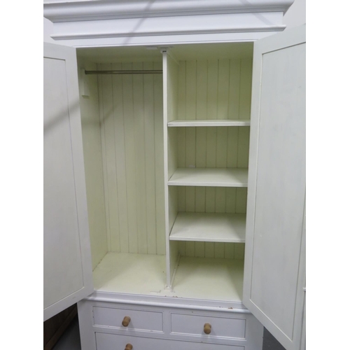 81 - A Shabby Chic painted wardrobe with a shelved interior to one side and hanging to the other, over th... 